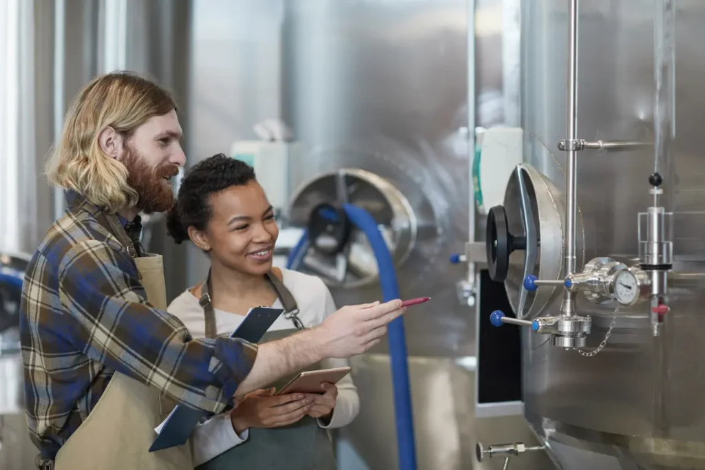 Two people in brewery